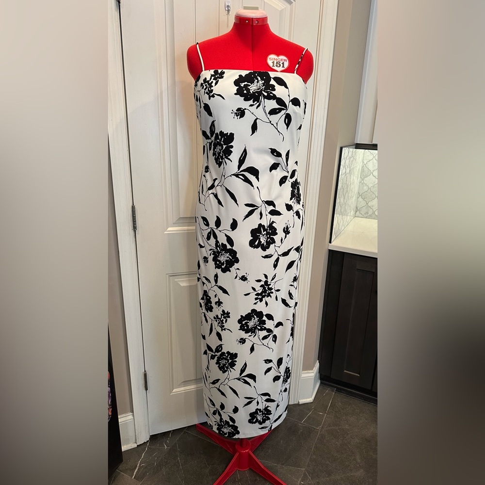 Gorgeous, black and white floral dress with rhinestone accents on the flowers